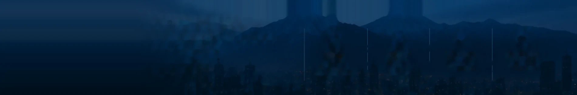 Cordillera y ciudad al anochecer